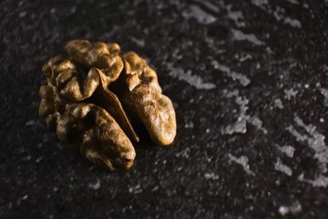 Walnut close up macro on black background. Stock Photos