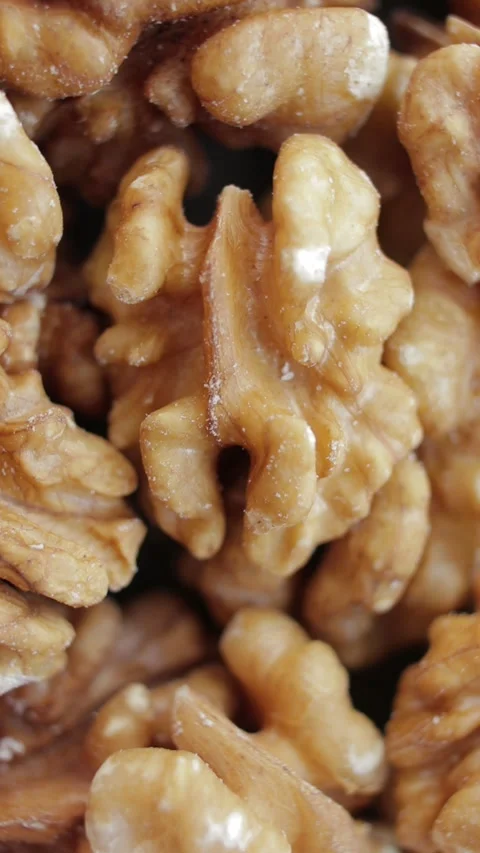 Walnut close up. Walnut kernels rotating. Rotating nuts background. Stock Footage 271641620