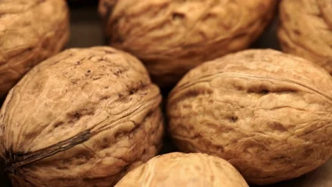 Walnut close up on a wooden table Stock Footage 234995986