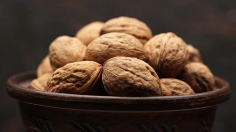 Walnut close up on a wooden table Stock Footage 234996378