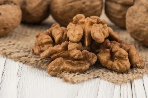 Walnut closeup on an old white table. 스톡 사진