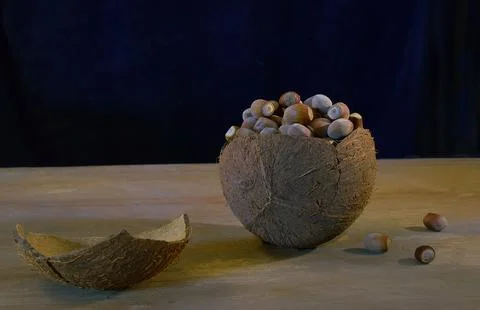 Walnut coconut hazelnuts on an old table. Stock Photos
