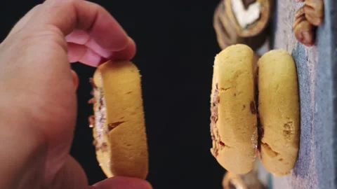 A walnut cookies on a black background Stock Footage 208357891