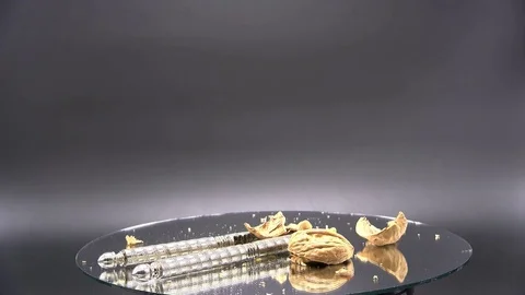 Walnut Crushed in Shell Nutcracker Rotating Isolated on Black, 4K Stock Footage 70376291