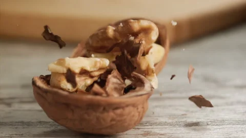 Walnut falling and cracking on close-up Stock Footage 152175722