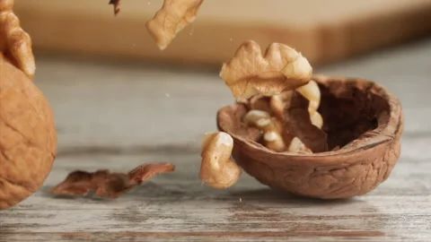 Walnut falling and craking on close-up Stock Footage 152175700