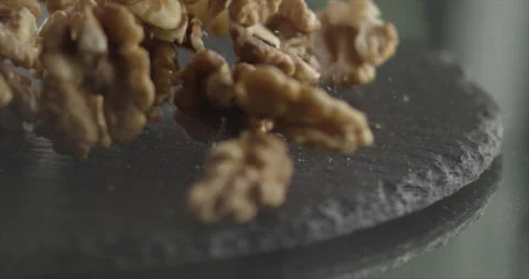 Walnut falls on a black surface Stock Footage 199021946