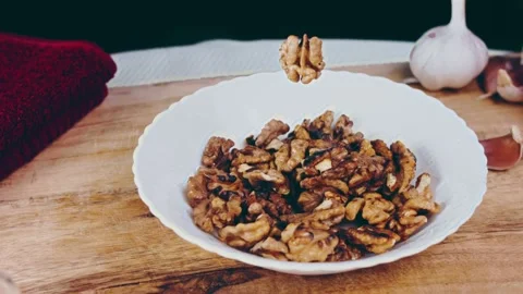 The walnut floats in the air, Candle effect Stock Footage 232851387