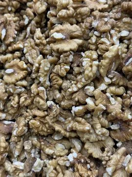 Walnut halves closely packed creating a textured natural background for hea.. Stock Photos