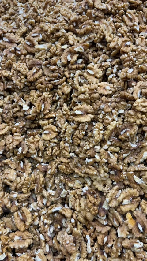 Walnut halves piled together creating a textured, nutritious background of .. Stock Footage 335157992
