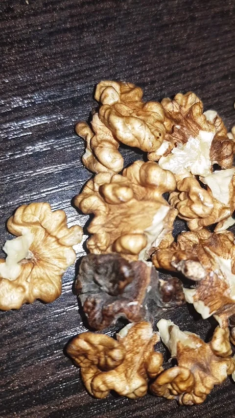 Walnut heart, unveiling the delicious, nutritious kernel freed from its husk Stock Footage 311342263