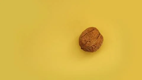 Walnut isolated on a yellow background. Stock Photos