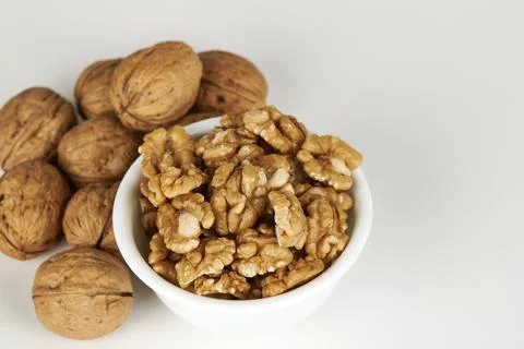 Walnut kernel in a bowl Stock Photos