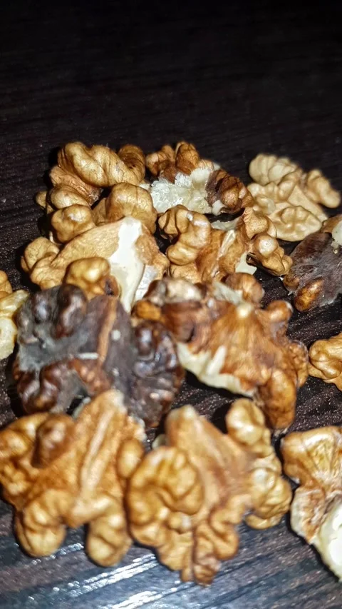 Walnut kernel is featured in this intimate close-up that showcases the heart nut Stock Footage 295427287