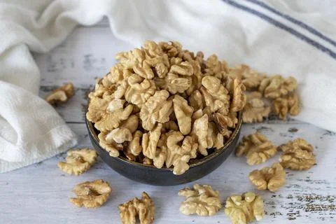 Walnut kernel on wood floor. Nuts. Healthy food. close up Stock Photos