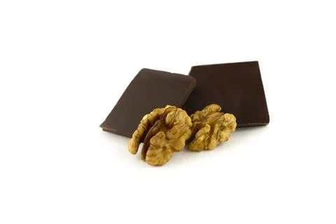 Walnut kernels and two dark chocolate bars Stock-Fotos