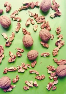 Walnut kernels and whole walnuts Stock Photos