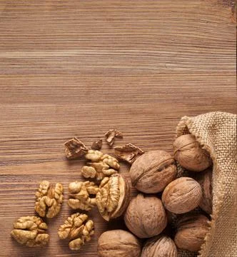 Walnut kernels and whole walnuts Stock Photos