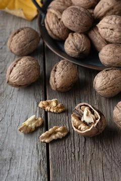 Walnut kernels and whole walnuts Stock Photos