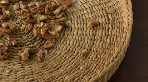 Walnut kernels in basket and whole walnuts Stock Footage 56718617