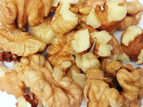 Walnut Kernels Close Up on White Background Stock Photos