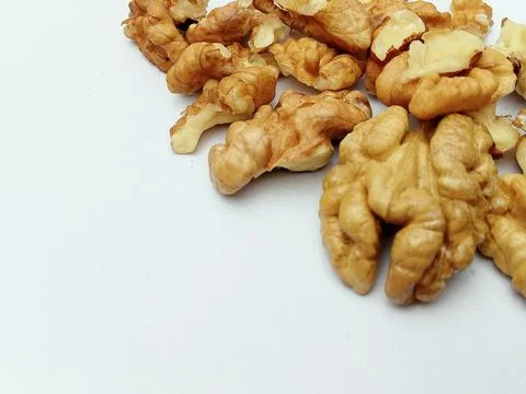 Walnut kernels close up on white background Stock Photos