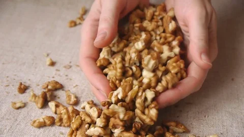 Walnut Kernels In Hands Stock Footage 76717906