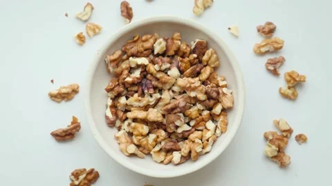 Walnut kernels on a plate, top view, close-up Stock Footage 195529309