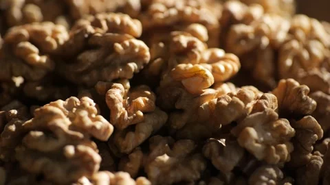 Walnut kernels rotating. walnut close up lies under beams of the sun. Walnut Stock Footage 266817333