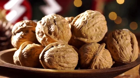 Walnut kernels on rustic old wooden table with christmas background. Slide sh Stock Footage 83552517