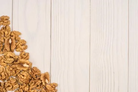 Walnut kernels on rustic old wooden table Stock Photos