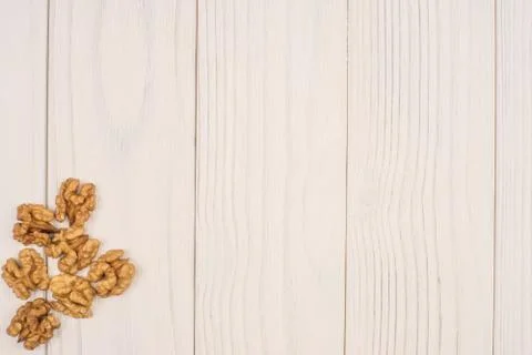 Walnut kernels on rustic old wooden table Stock Photos