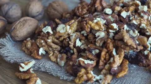 Walnut kernels on rustic wooden table. Stock Footage 85720670