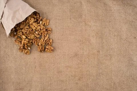 Walnut kernels walnuts on burlap. Stock Photos