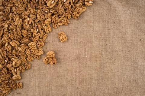 Walnut kernels walnuts on burlap. Top view. Stock Photos