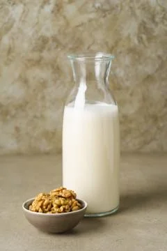 Walnut milk in a bottle Stock Photos