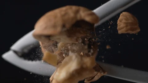 Walnut in nut cracker. Slow Motion. Stock Footage 89612740