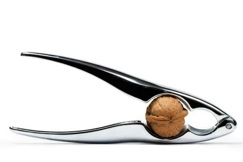 Walnut in a nutcracker Stock Photos