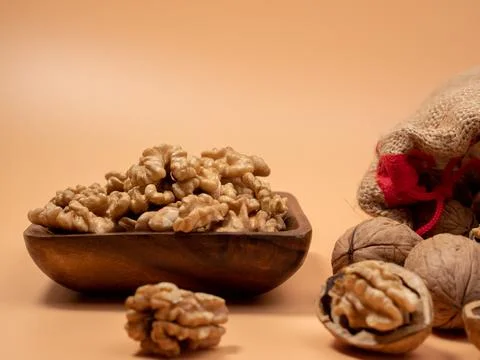 Walnut on an orange background. Raw walnut. 스톡 사진
