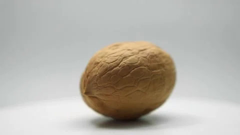 Walnut rotating on a white background close-up. Stock Footage 144443640