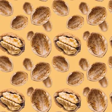 Walnut seamless pattern on brown background. Open nut shell and kernel Stock Photos