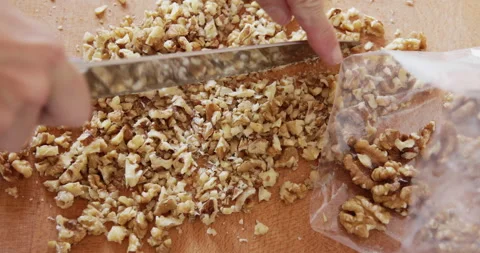 Walnut seed chopping close up Stock Footage 327755323