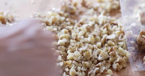 Walnut seed chopping close up Stock Footage 327755354