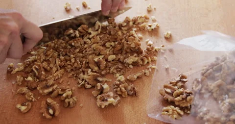 Walnut seed chopping close up Stock Footage 327755404