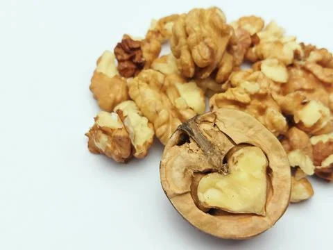 Walnut shell and kernels close up Stock Photos