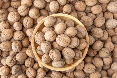 Walnut in shell. Background view from above. Healthy food bowl top view. Stock Photos