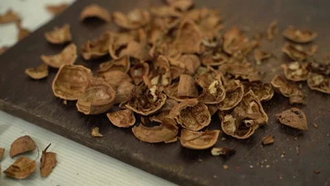 Walnut shell close-up on a wooden board, parallax Stock Footage 232975201