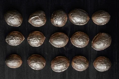 Walnut shell on a dark background Stock Photos