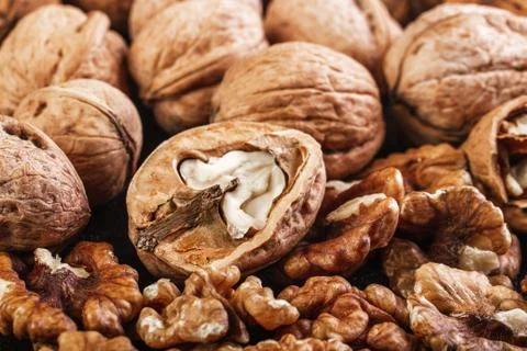 Walnut in shells and peeled Stock Photos