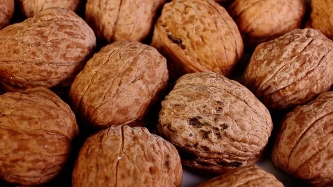 Walnut texture. Brown big whole walnuts as background. walnut nuts pattern close Stock Footage 99323297